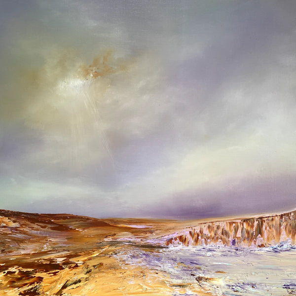 Coastal landscape with cliffs under purple sky with sunlight breaking through