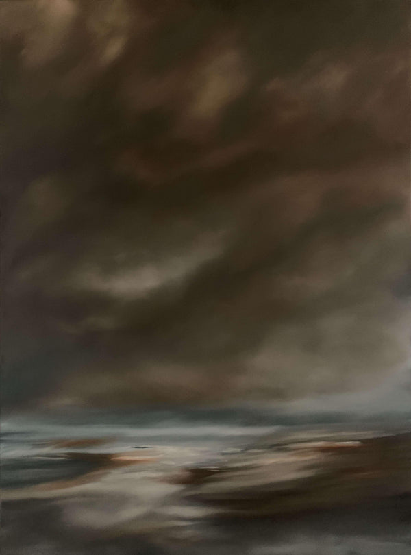 Dark stormy clouds over a body of water