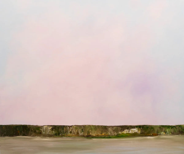 Expansive pink sky over cliffs 