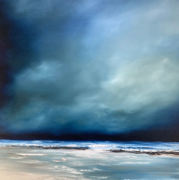 Dark storm clouds over a beach