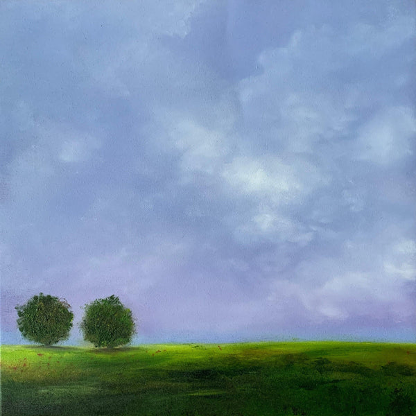 Two trees on a grassy hill with a purple sky