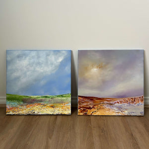 small landscape paintings against wall 